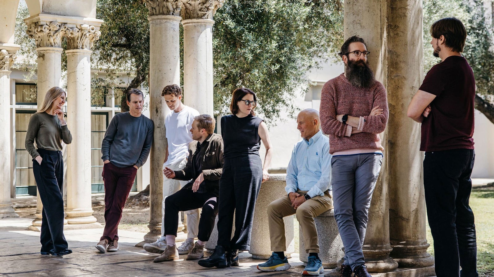 Andy Konwinski seated with the founding team of Laude Institute