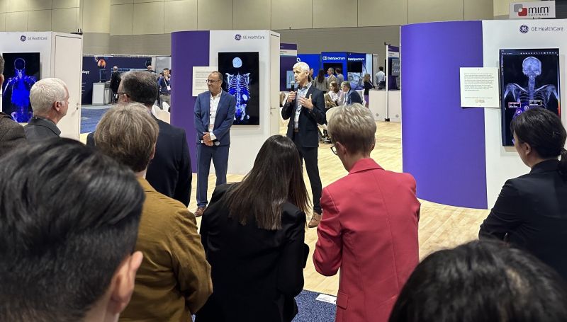 Andy Nelson speaking to an assembled group at the 2024 MIM and GE HealthCare welcome event.