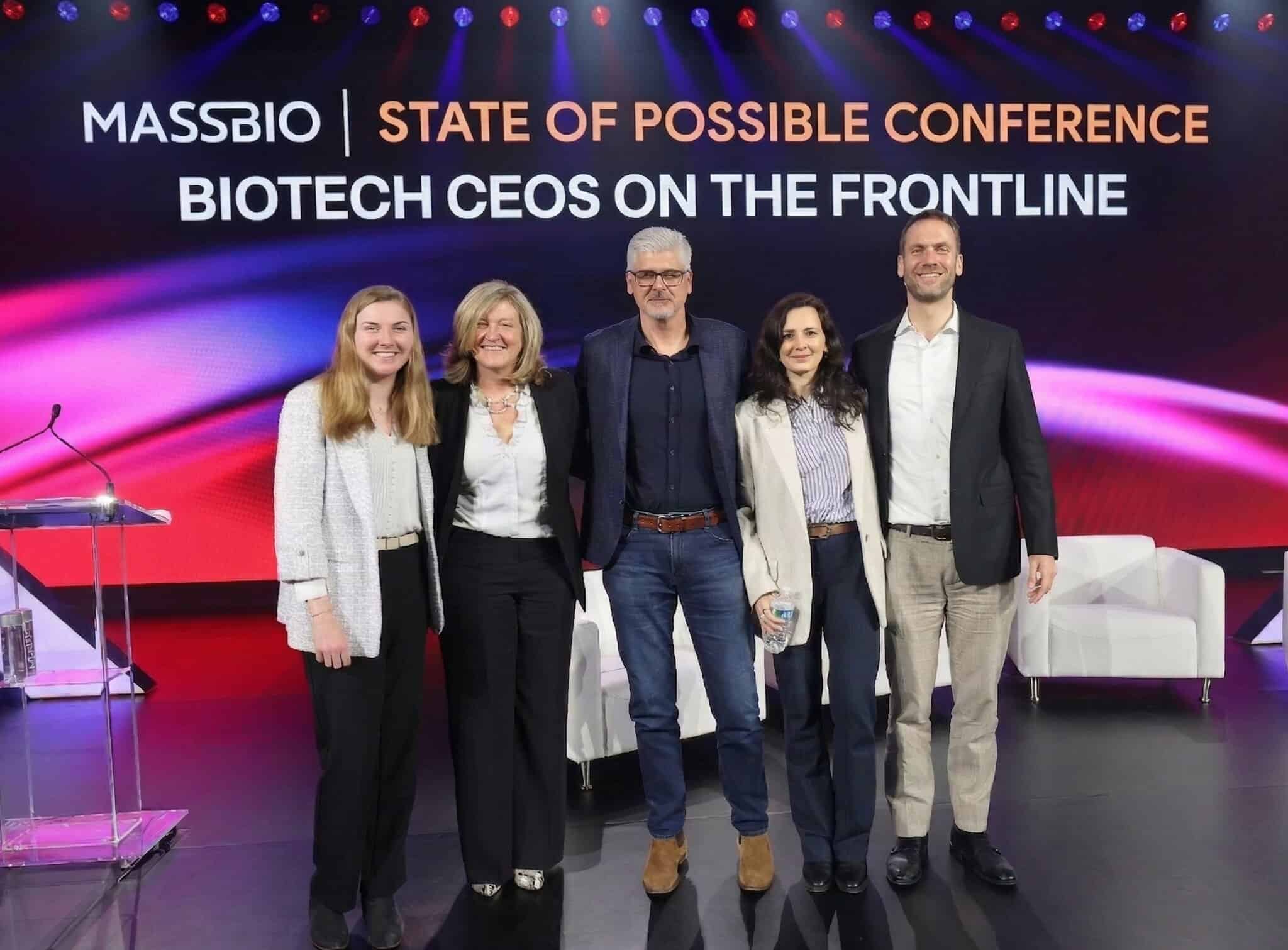 Andy Orth stands with fellow biotechnology executives after a leadership panel at the 2026 MassBio State of Possible Conference