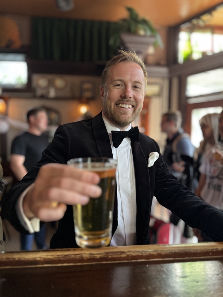 Andy Sparks raising a glass at Shotwell’s Saloon on his wedding day