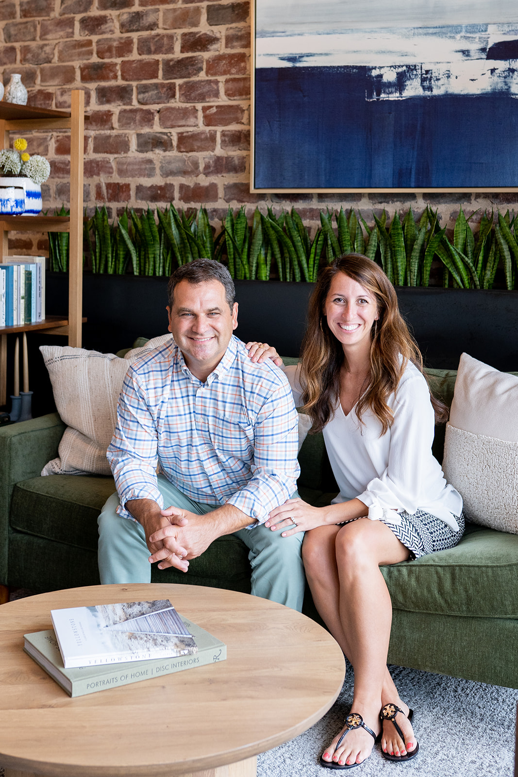 Andy and Brittany Thoms seated together in an office