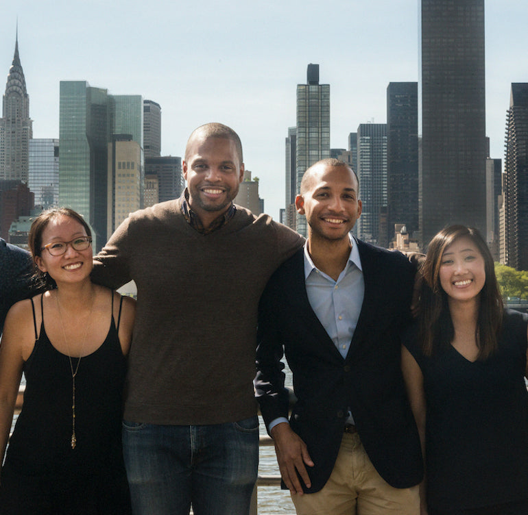 Chatdesk leadership team together with the New York skyline behind them