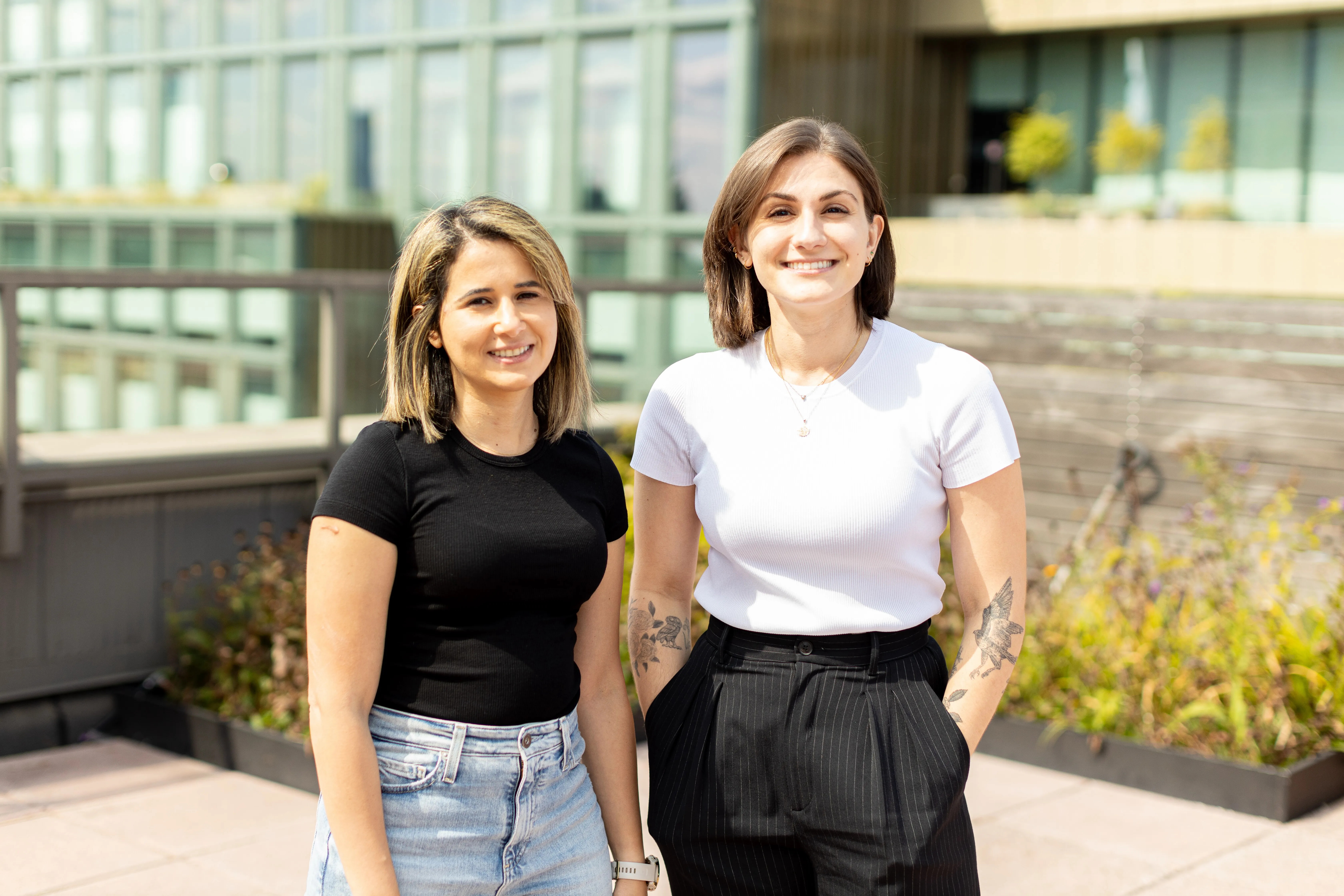 Thread AI co-founders Mayada Gonimah and Angela McNeal standing outdoors