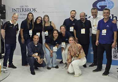 Angeles Magalhães with colleagues at the Gallagher and Interbrok exhibition stand
