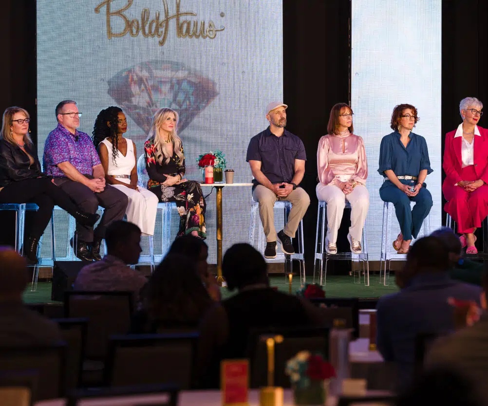 Angelique Rewers seated with fellow panelists on a BoldHaus stage