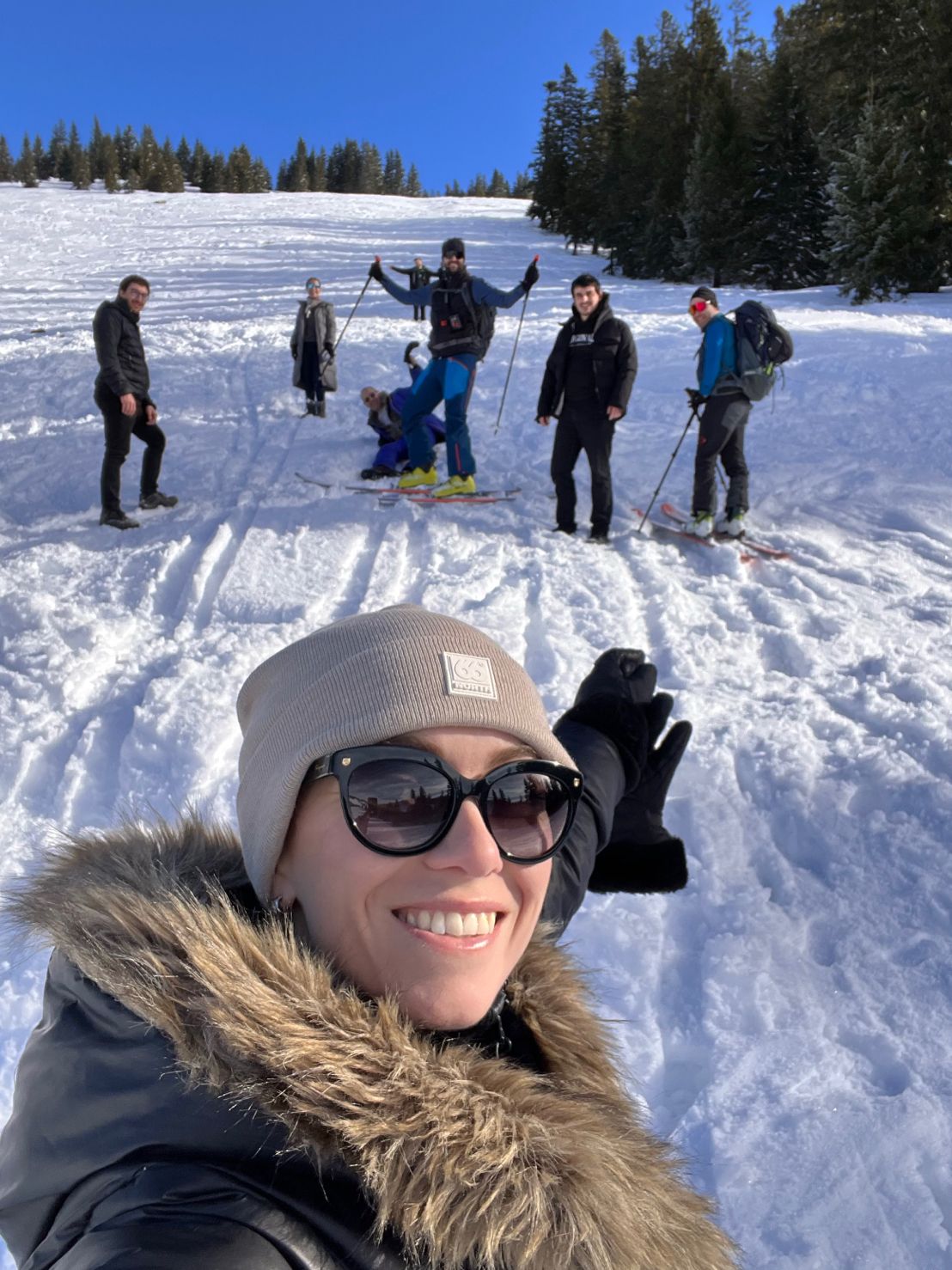 Ani Adzhemyan taking a group selfie with the Software Defined Automation team on a snowy ski slope