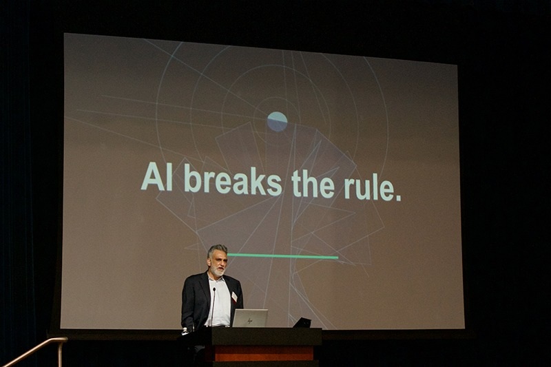 Anil Kaul speaking at a lectern beneath a slide reading AI breaks the rule, at the Worcester Economic Club in May 2026.
