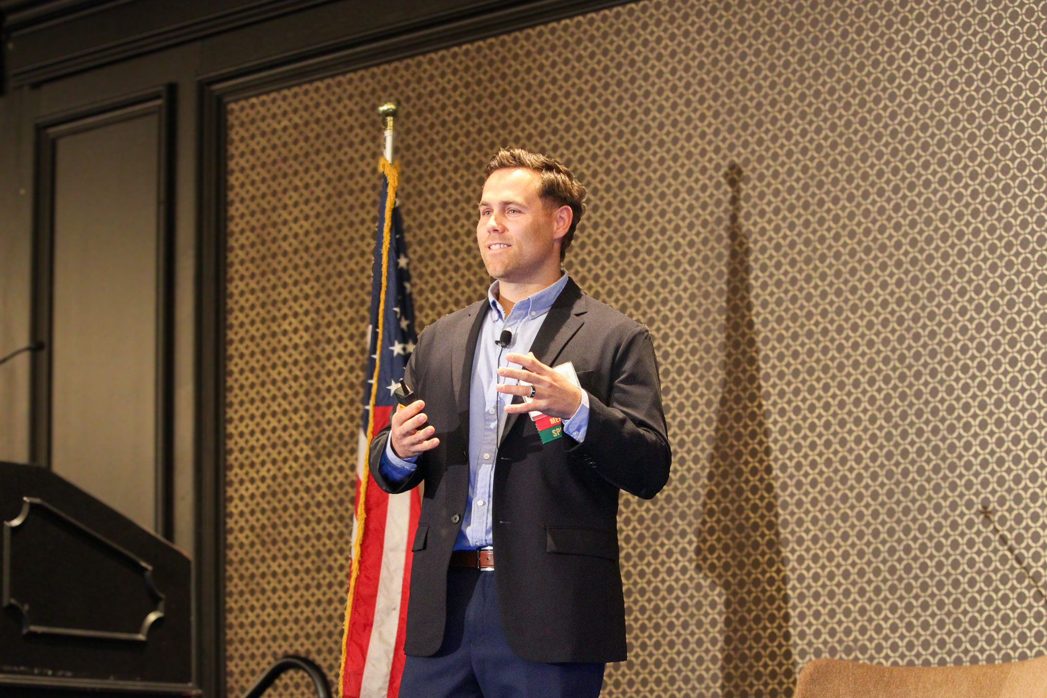 A speaker presents onstage during the 2026 Animal Agriculture Alliance Stakeholders Summit