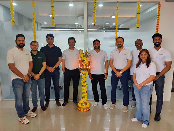 Centricity colleagues gathered around a ceremonial lamp at the Bengaluru office opening
