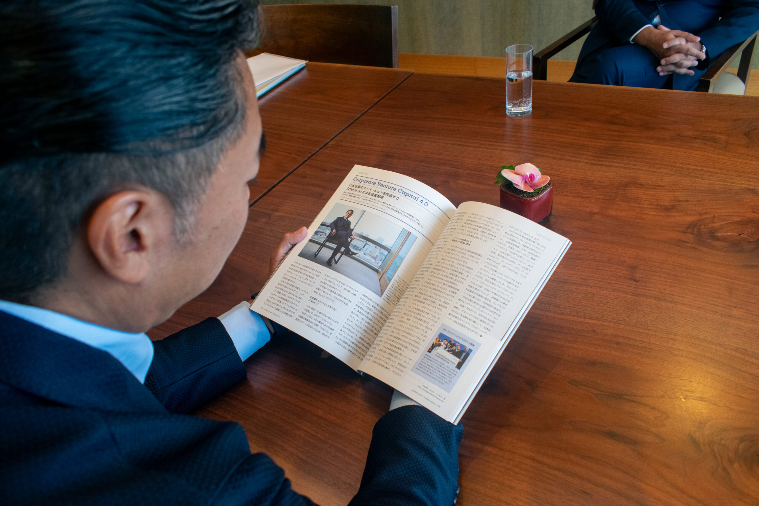 A magazine feature about corporate venture capital open on the table during the Tokyo interview