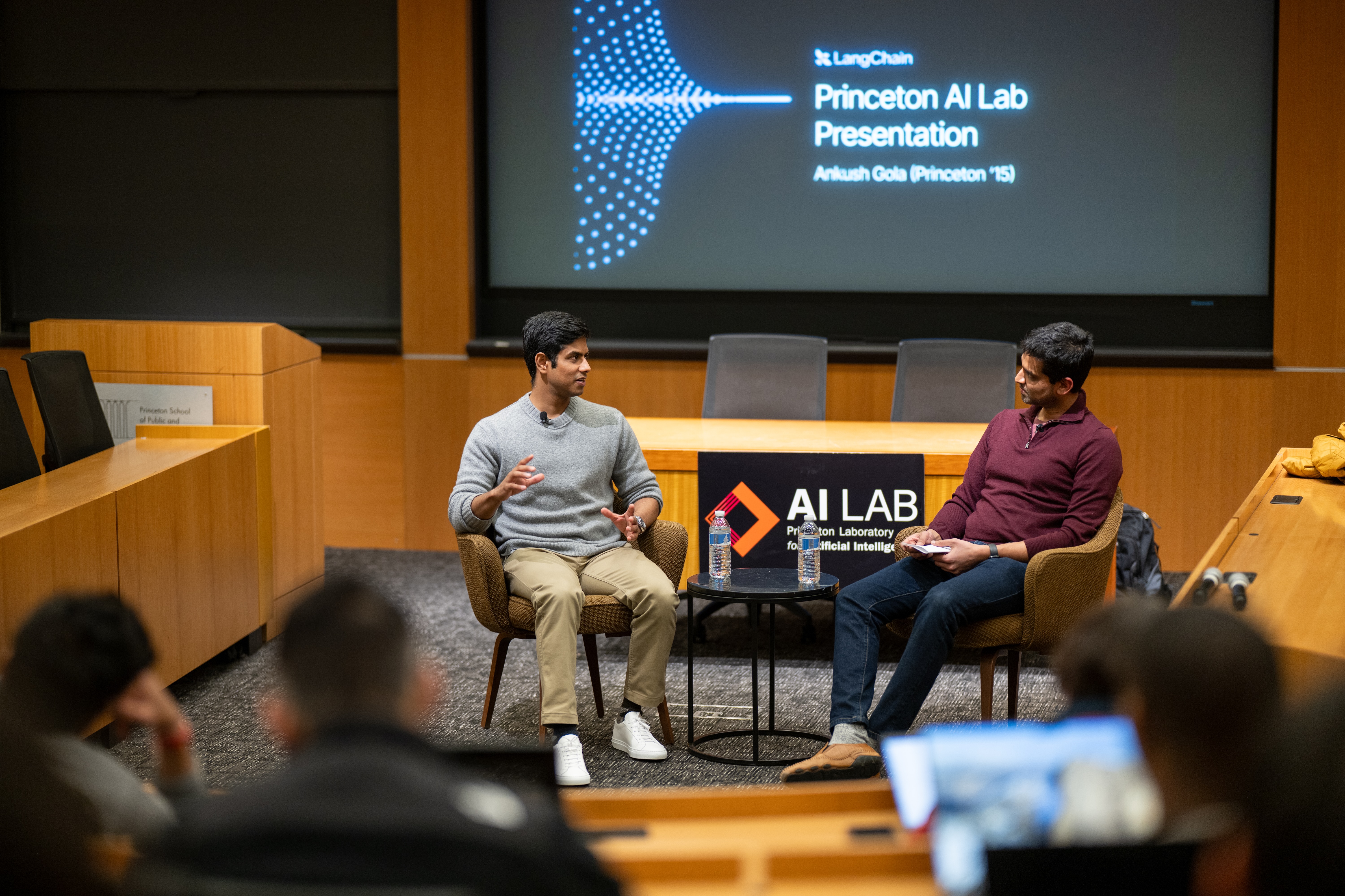 Ankush Gola speaking with professor Karthik Narasimhan at Princeton's AI Lab in March 2026