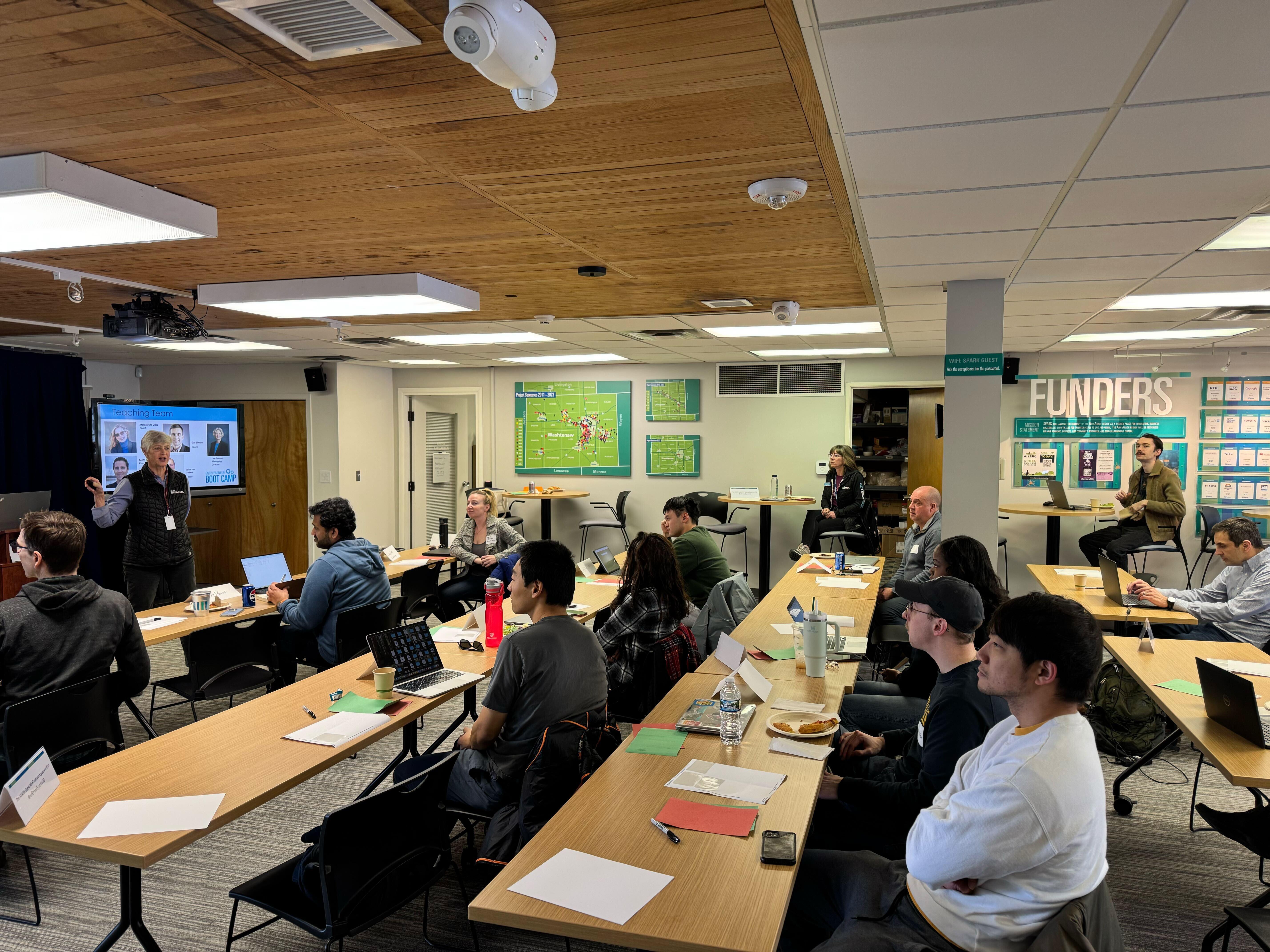 Entrepreneurs working at laptops during an Ann Arbor SPARK Boot Camp session