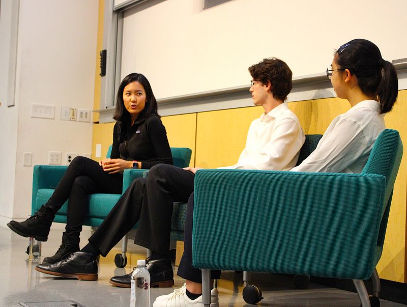 Ann Wu seated at a Stanford IEEE discussion about AI-native chip design