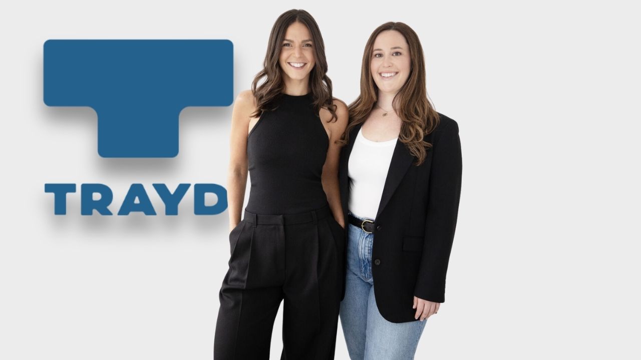 Anna Berger and Cara Kessler standing together in front of a Trayd backdrop