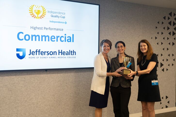 Jennifer Stephens, Anna Flattau and Ellen Riccobene hold Jefferson Health's Independence Quality Cup in Philadelphia