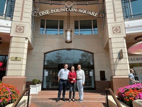Three Cloudpermit team members outside One Fountain Square in Reston, Virginia