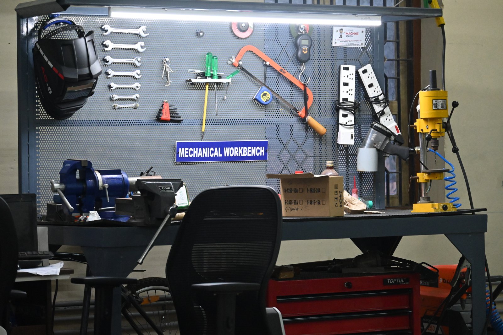 AIIRF mechanical workbench with hand tools, a bench vice and drill