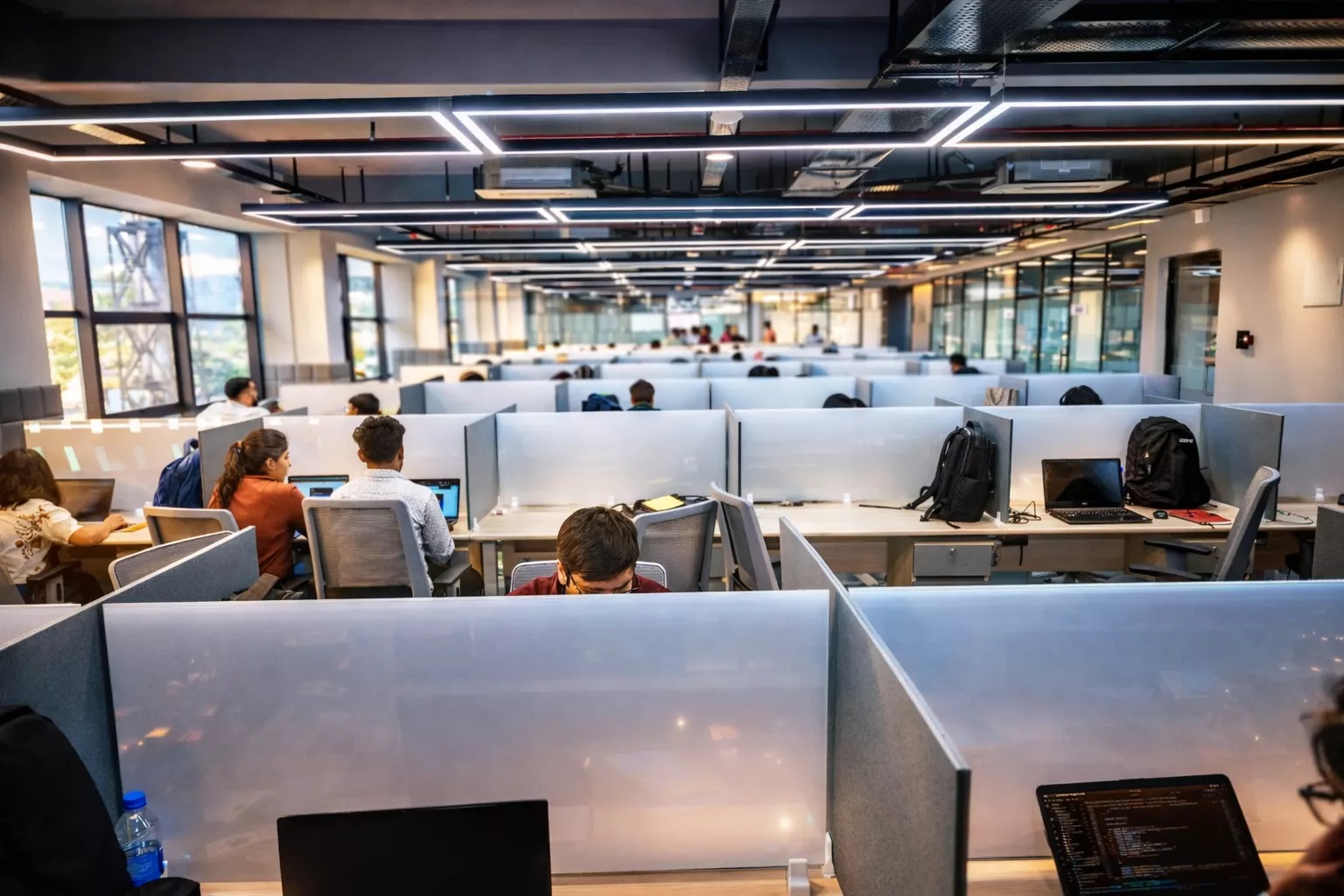 Daylit desks and glass partitions inside Muvi Spaces in Bhubaneswar