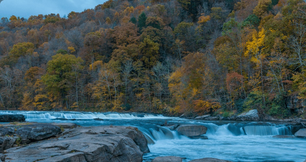Wooded Appalachian hills and a river waterfall, pictured on Antero's operations website