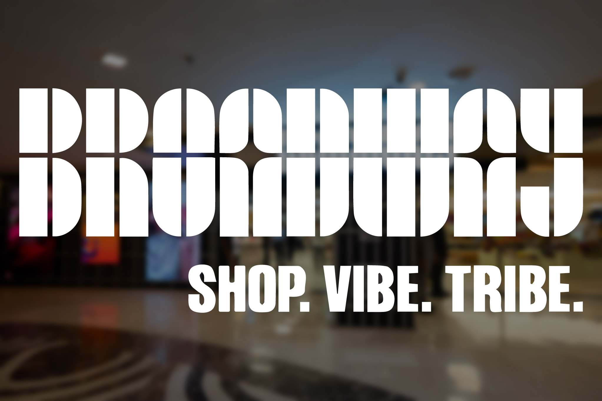 Broadway promotional artwork over a blurred retail interior, reading Shop Vibe Tribe