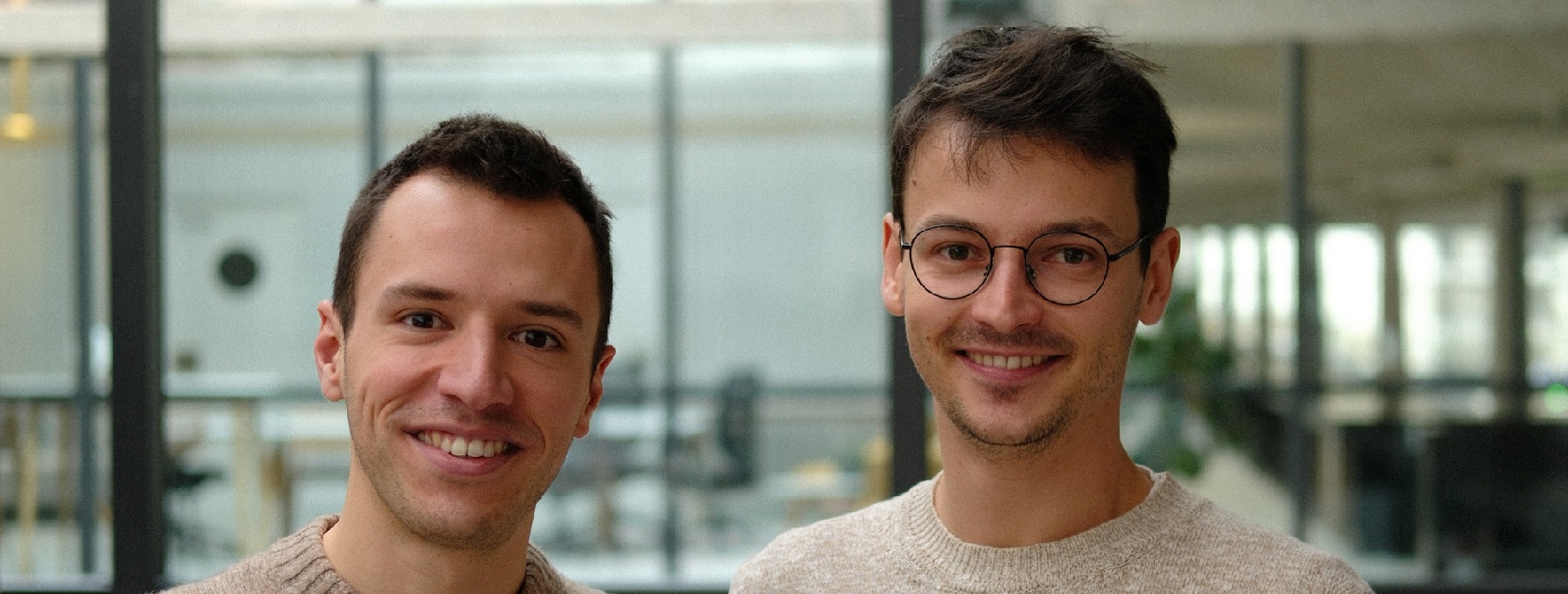 Antoine Moissenot on the left and Alexandre Pasquiou on the right, standing together in an office.