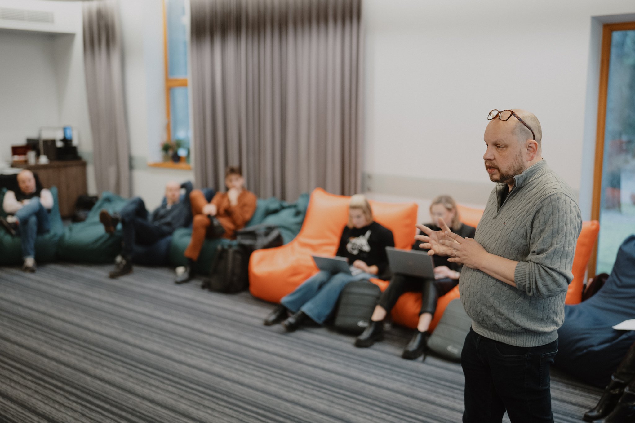 Antti Korhonen speaking to Edu Challenger participants seated on beanbags