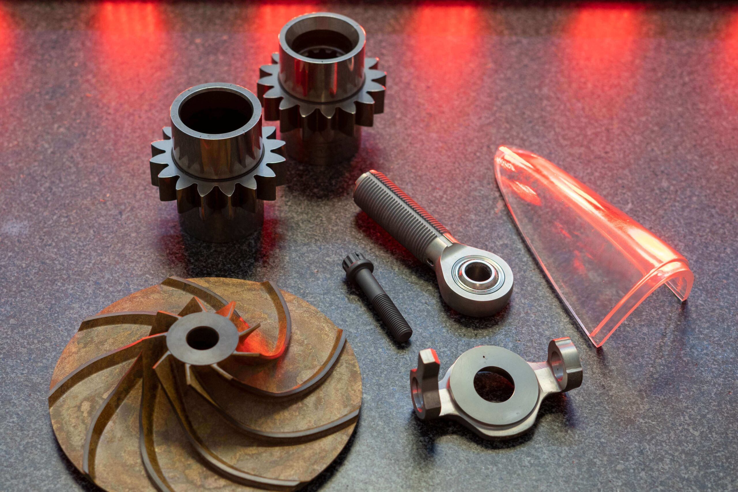 A selection of machined aircraft components photographed on a work surface