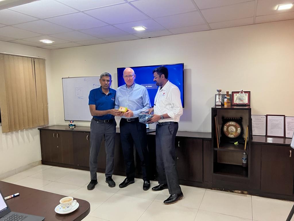 APA leaders presenting a gift to GPC Global Sourcing managing director Phil Hekman during his 2022 visit
