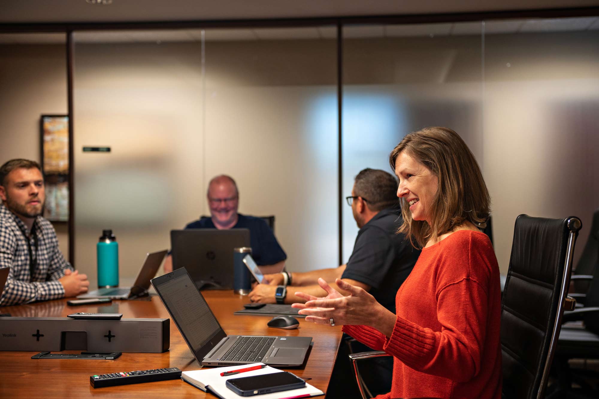 Apex Analytix associates meeting in a bright conference room