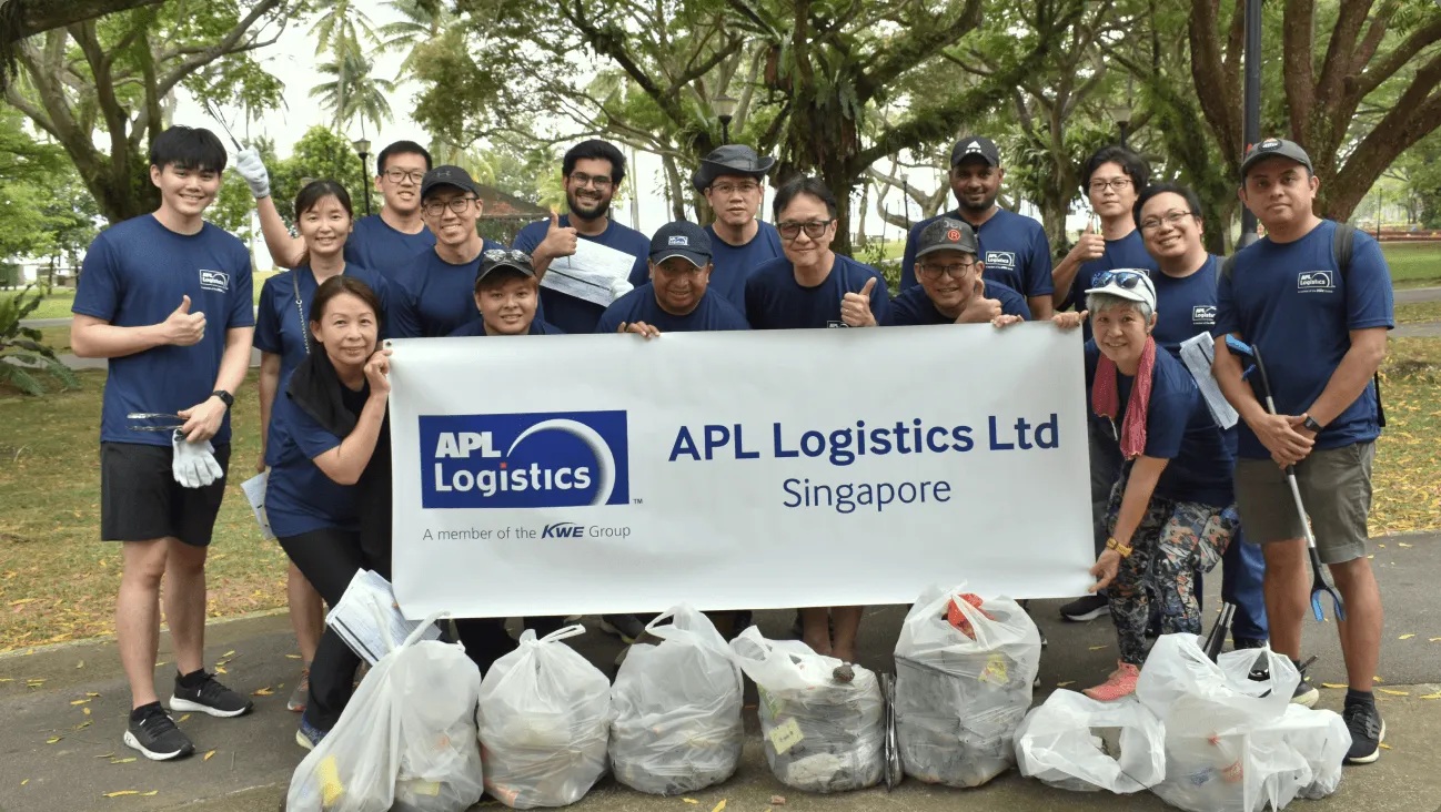 APL Logistics Singapore colleagues with gloves, litter pickers, and collected rubbish