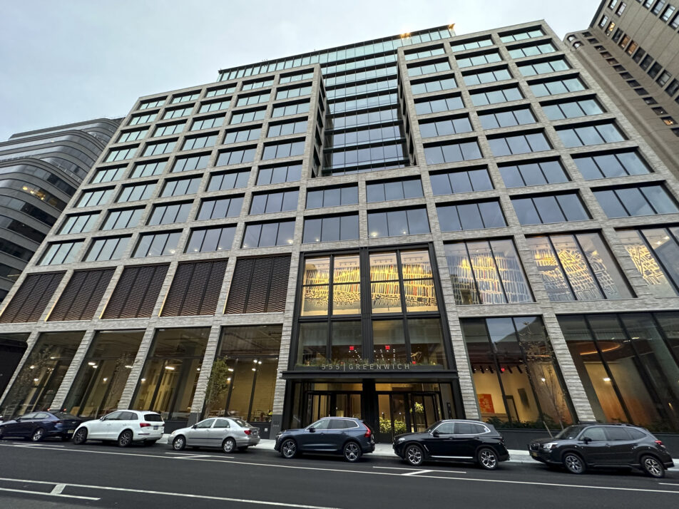 Street-level view looking up at the glazed façade of 561 Greenwich in New York