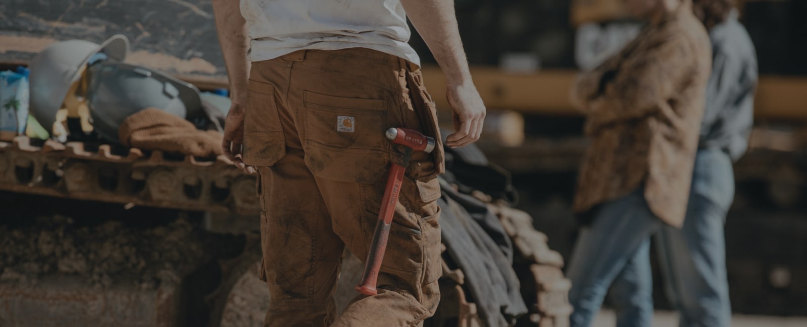 Carhartt workwear and tools in a workshop