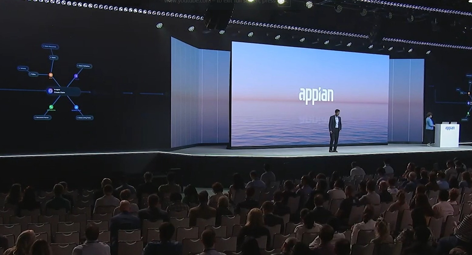 An Appian conference stage showing a network of AI agents and process steps