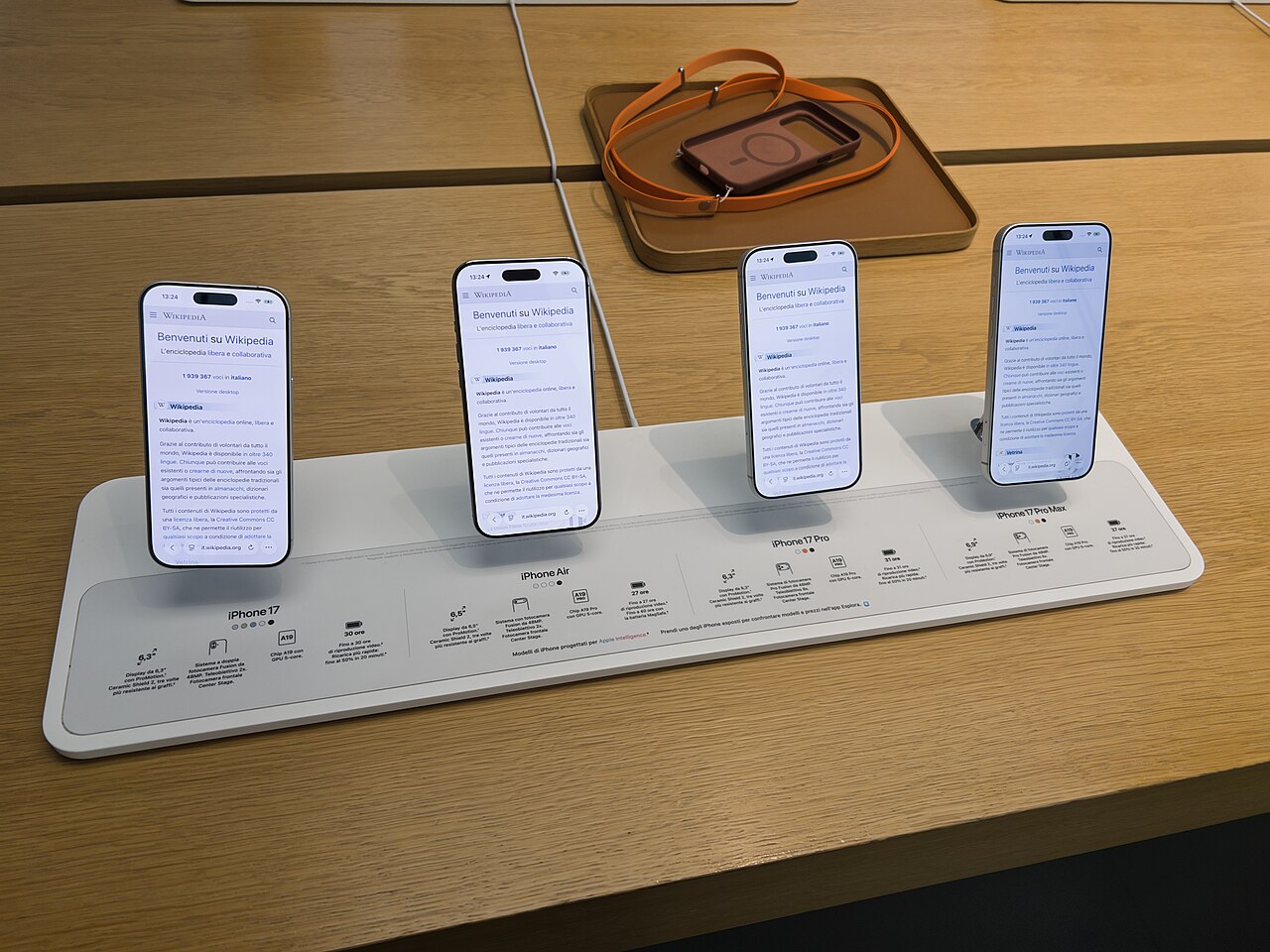 iPhone 17, iPhone Air, iPhone 17 Pro and iPhone 17 Pro Max on a display table in an Apple Store