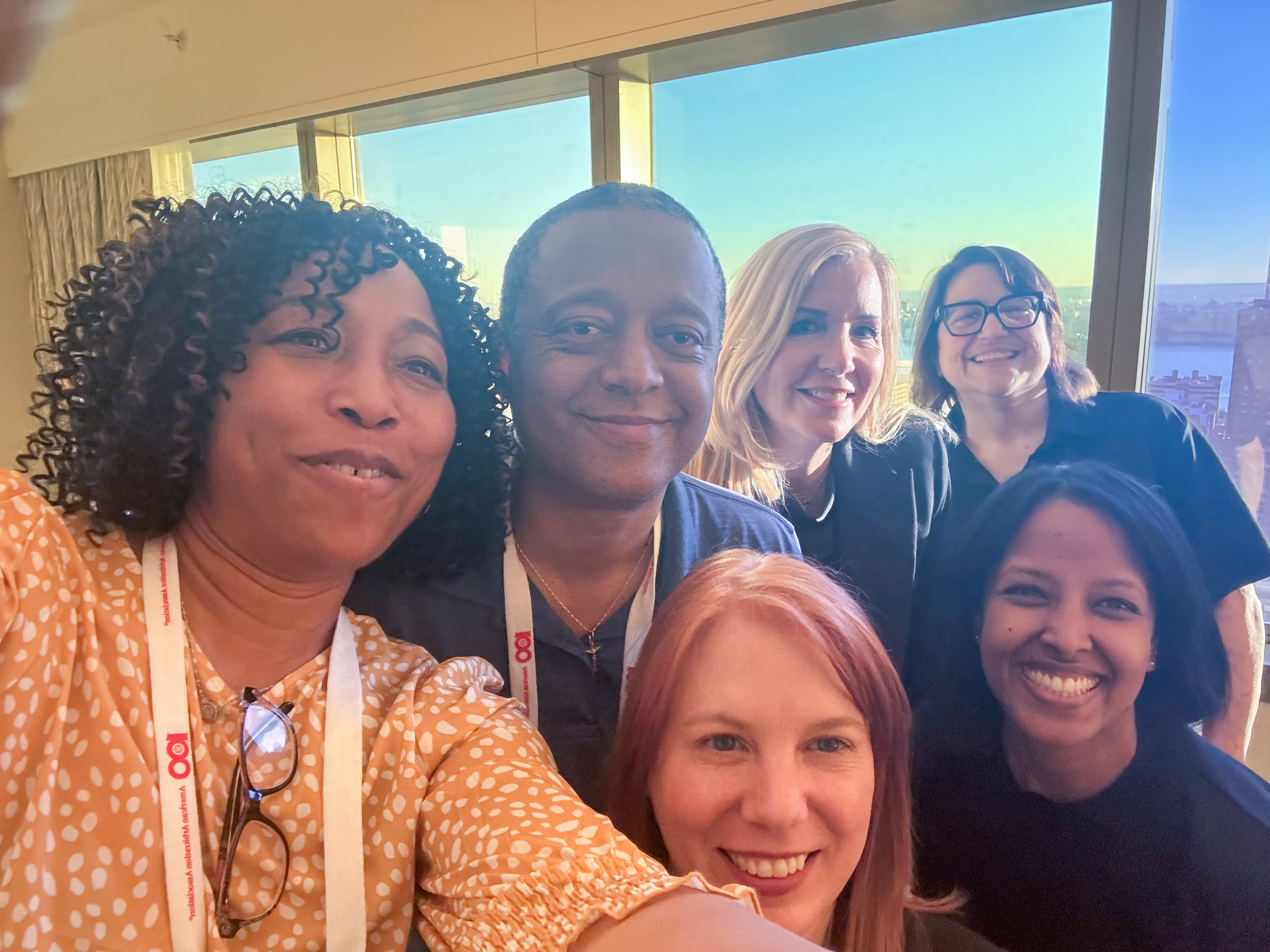 A group of legal-technology colleagues taking a selfie at Legalweek 2026