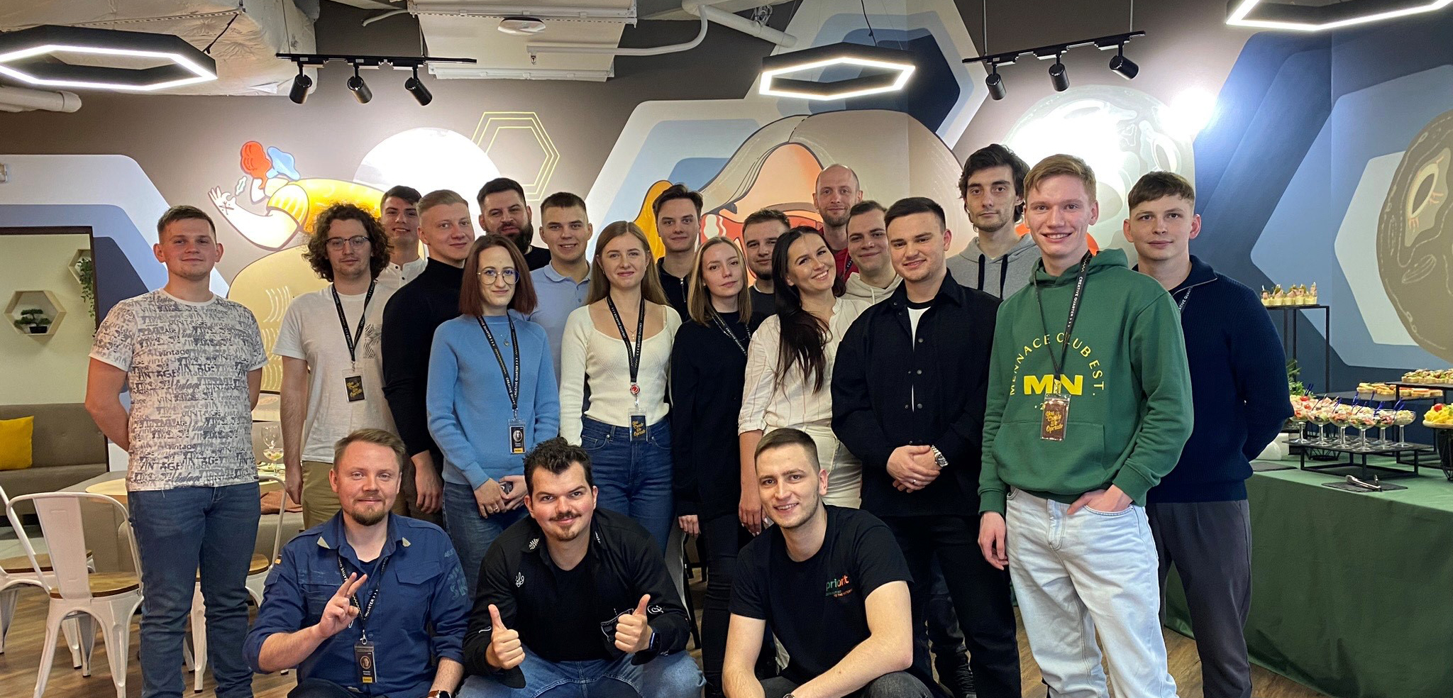 Apriorit colleagues gathered for a group photograph in an office lounge