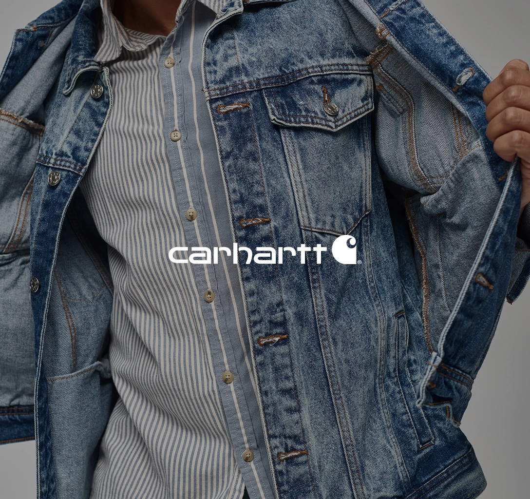 Aptean promotional customer photograph showing a Carhartt model in workwear