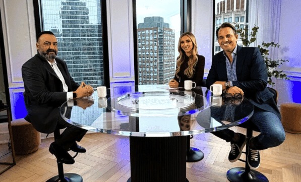Aqil Chishty seated on the Inside Business Today set with Bill and Giuliana Rancic