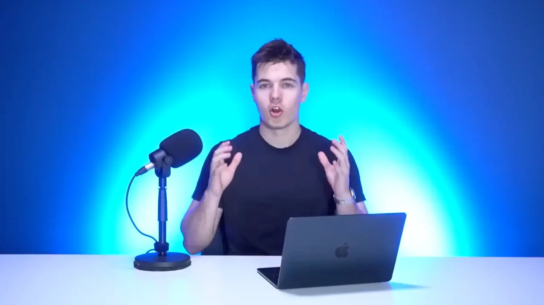A presenter in a blue-lit studio shown in an Arcads website video