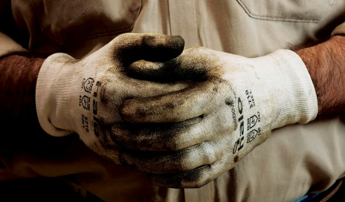 Close-up of clasped work gloves