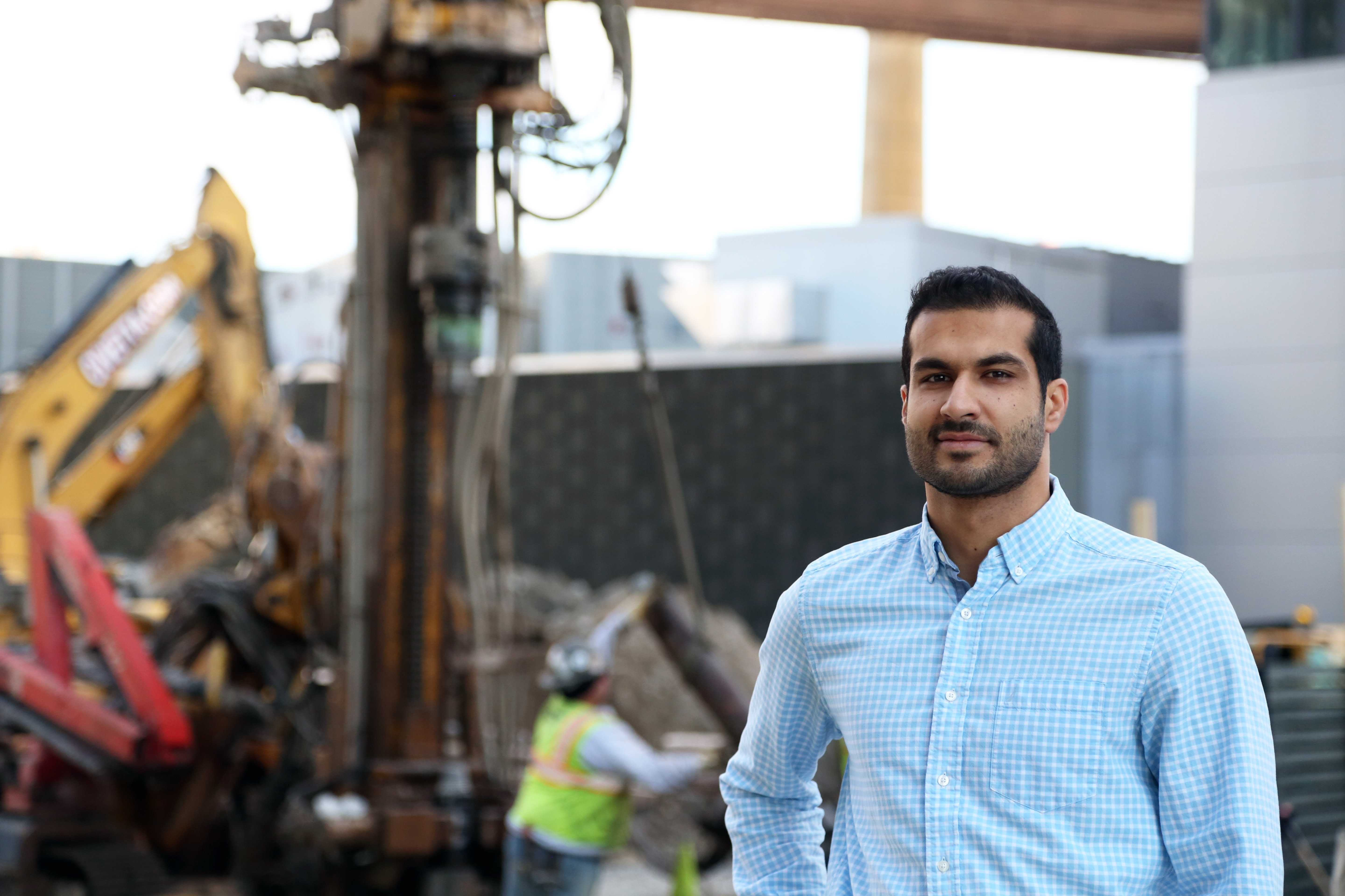 Ardalan Khosrowpour standing at an active construction site