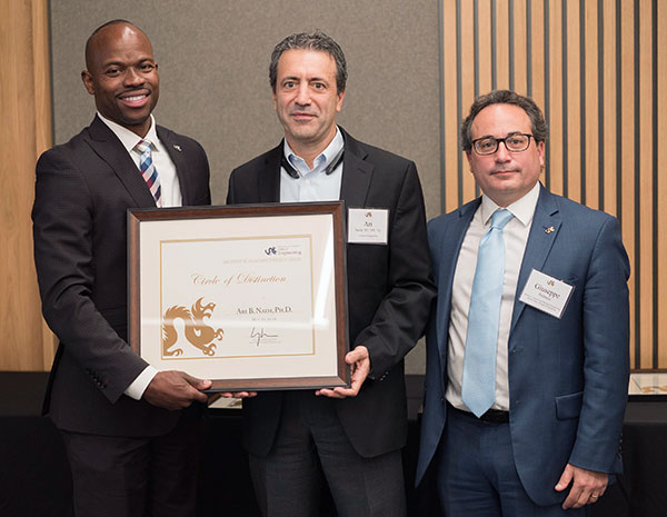 Ari Naim, center, holds his Drexel Circle of Distinction certificate with Brian Blake at left and Giuseppe Palmese at right.
