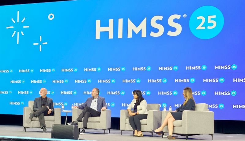 Aric Sharp seated second from left during a four-person HIMSS 2025 panel