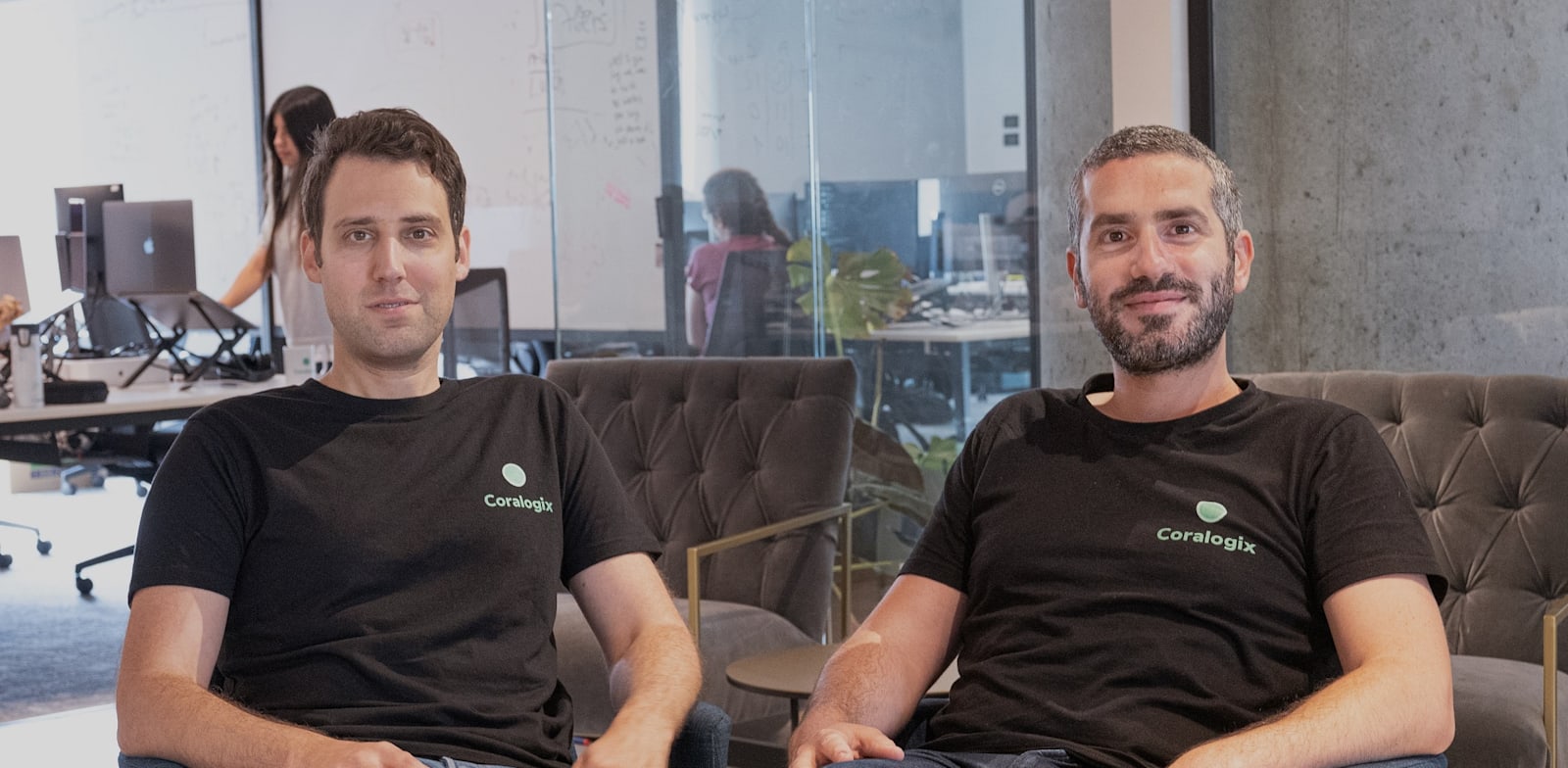 Coralogix co-founders Yoni Farin and Ariel Assaraf seated in their office
