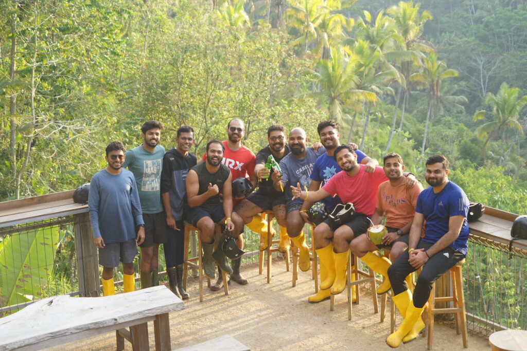 Docket team members gathered outdoors in yellow boots