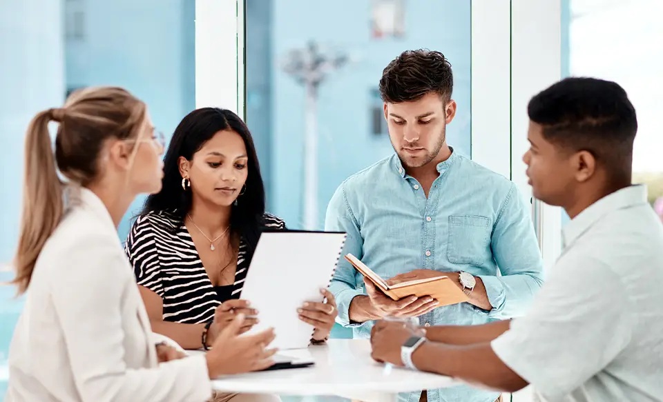 Illustrative business meeting shown on ARK InfoTech Spectrum’s website