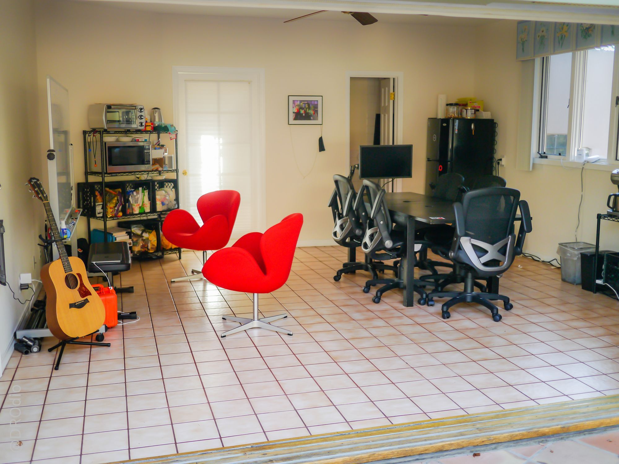 Armory’s early garage workspace, with people working around a table