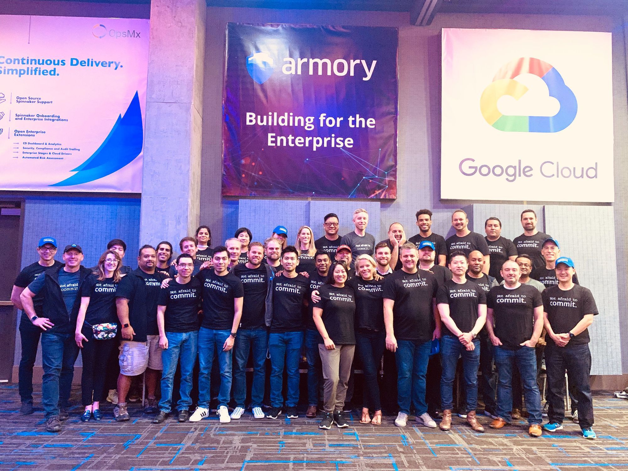 Armory team at Spinnaker Summit wearing shirts that say Not afraid to commit