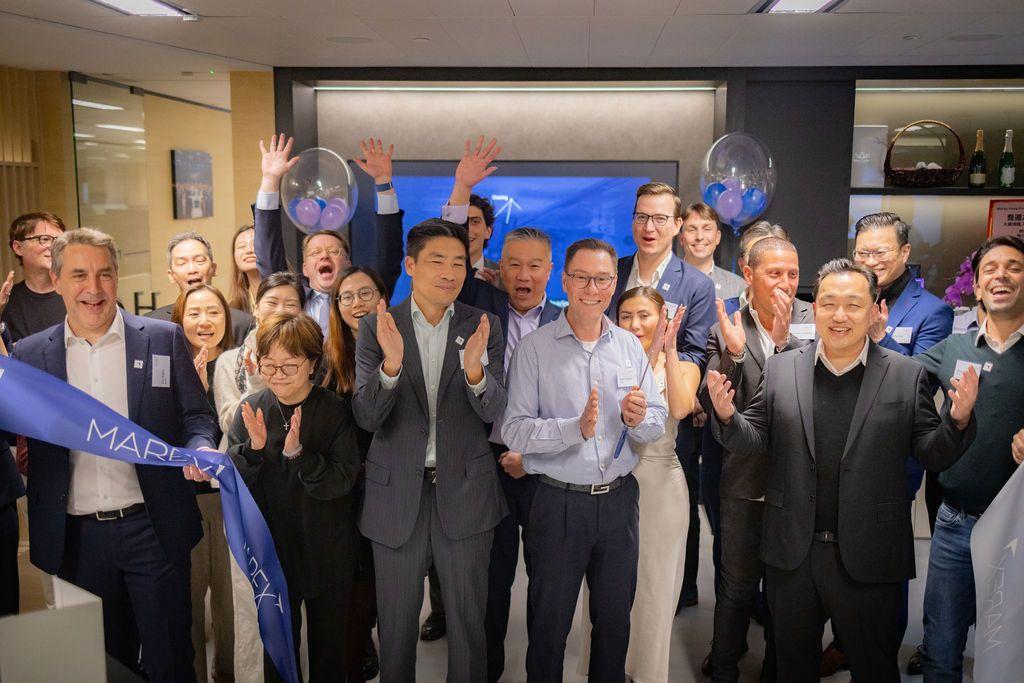 Marex colleagues applaud at the ribbon cutting for the Hong Kong office opening