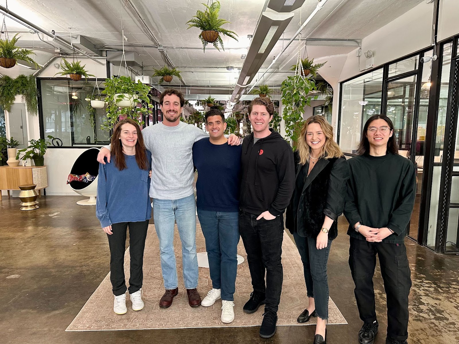Arthur Leopold and members of Agentio's early team standing together in the company's New York workspace